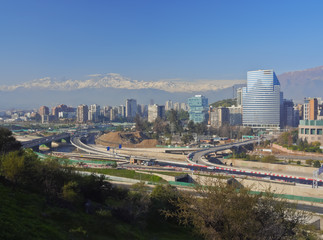 Chile, Santiago, View from the Parque Metropolitano towards the high raised buildings in financial sector. Snow covered Andes in the background.