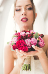 Luxury wedding bride, girl posing and smiling with bouquet