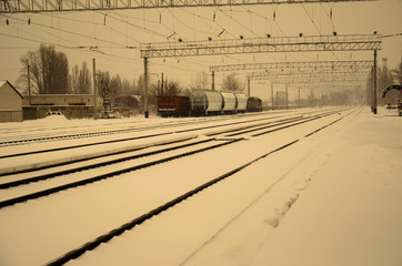 Fototapeta na wymiar View on a railroad tracks on winter. Retro style
