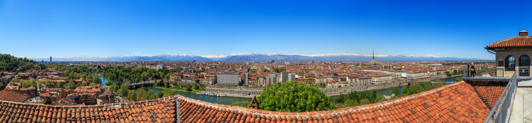 Fototapeta na wymiar Turin, Piedmont, Italy, view of Turin, the Po and the snow-capped Alps, from the lookout Mount of the Capuchins, panorama.
