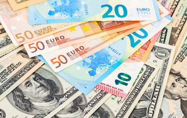 Money background from euro banknotes and american dollars