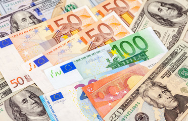 Background of different currency. Euro banknotes and american do
