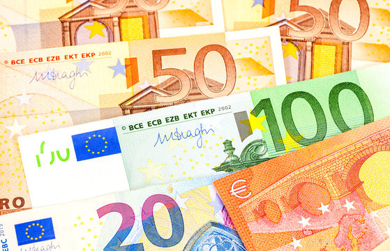 Background from different euro banknotes close up