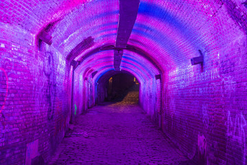 Purple and pink illuminated Ganzemarkt tunnel in Utrecht, The Netherlands