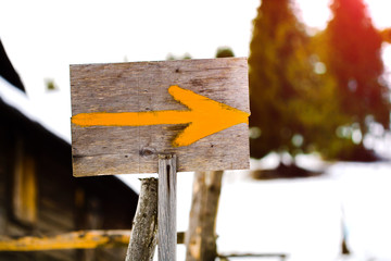 Wooden pointer of the route.