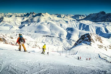 Foto op Plexiglas Skiers skiing downhill in French Alps,Alpe d Huez,Europe © janoka82