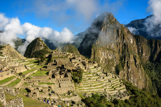 View of the Lost Incan City of Machu Picchu with clouds near Cusco, Peru. Machu Picchu is a Peruvian Historical Sanctuary.