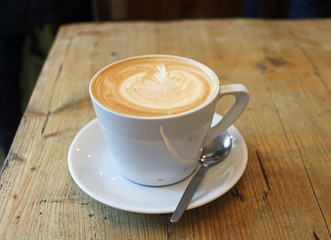 Cup of coffee on wooden table