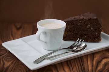 Cup of coffee and slice of chocolate cake