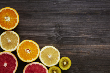 Fototapeta na wymiar vitamin c fruits in lower corner of the frame