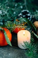 Film look image Christmas composition with Tangerines, Pine cone