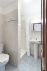 Fototapeta na wymiar Tiled bathroom with shower , small apartment