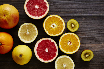Fototapeta na wymiar bunch of sliced organic plenty of vitamin c fruits