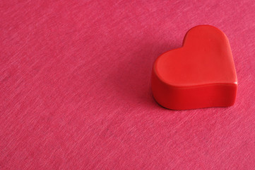 Valentine's Day. Red heart isolated against a pink background