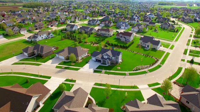 Beautiful, suburban neighborhood with stunning homes, aerial view.
