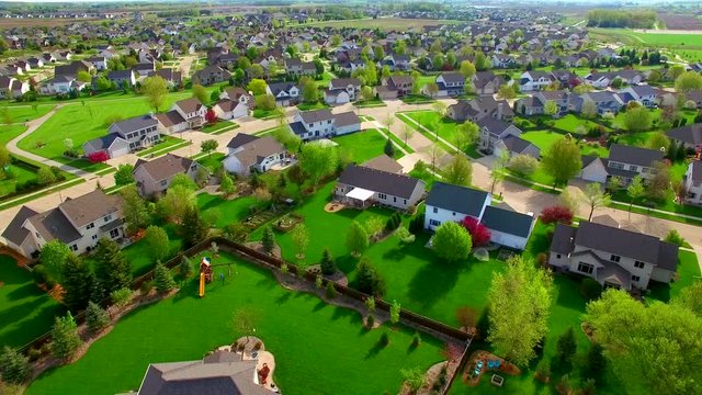 Beautiful, suburban neighborhood with stunning homes, aerial view.