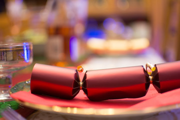 Red Christmas cracker on a plate