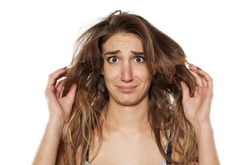 Fototapeta premium Portrait nervous stunned girl with messy hair