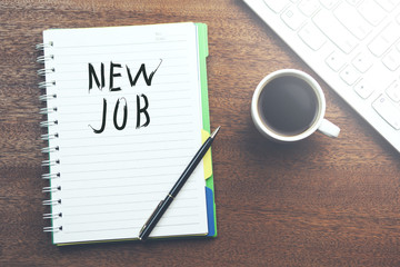 New job word on notepad on desktop