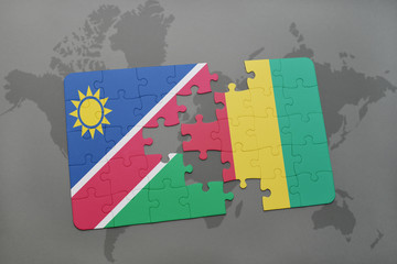 puzzle with the national flag of namibia and guinea on a world map