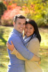 Fototapeta premium Young couple in love in an autumn setting