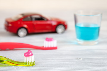 children's toothbrush oral care on wooden background