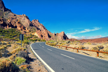 Volcano El Teide, Tenerife National Park. Road through the lava rocks in El Teide National park. Tenerife, Canary Islands, Spain.