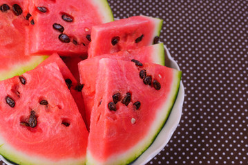 Cut pieces of red watermelon on a plate