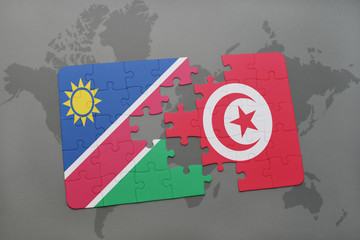 puzzle with the national flag of namibia and tunisia on a world map