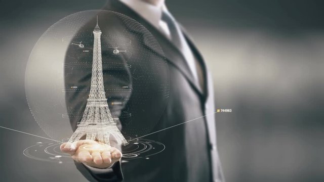 Businessman holding in Hand Landmark Eiffel Tower New technologies