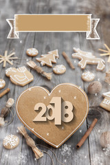 Christmas heart shaped gingerbread background. 2018 Winter holidays atmosphere. Snoflakes. Hand drawn ribbon for copy.Perfect for greeting cards, flyers, etc.Space for copy