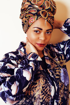 beauty bright african woman with creative make up, shawl on head like cubian closeup smiling, cheerful tan   lifestyle people concept