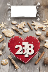Christmas heart shaped gingerbread background. 2018 Winter holidays atmosphere. Snoflakes. Hand drawn ribbon for copy.Perfect for greeting cards, flyers, etc.Space for copy