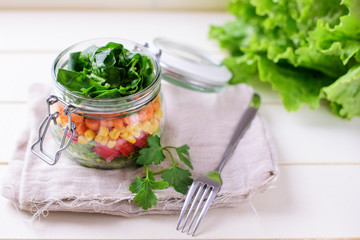 Homemade healthy salads with vegetables in jar