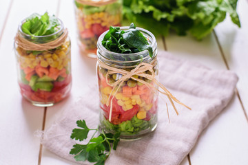Homemade healthy salads with vegetables in jar