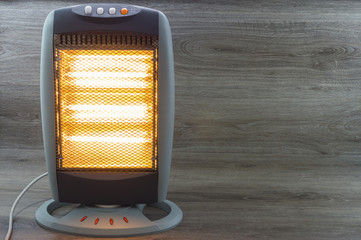 estufa electrica halogena iluminada y radiando calor