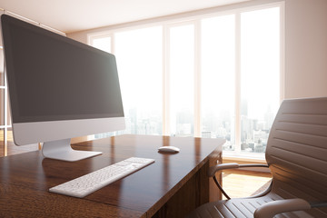 Workplace with empty computer screen side