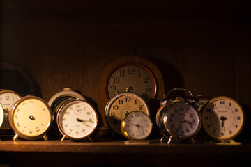 vintage clocks on wooden table