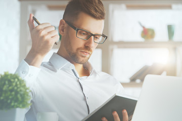 Man writing in organizer