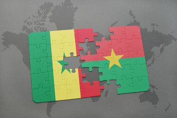 puzzle with the national flag of senegal and burkina faso on a world map
