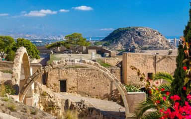 Ruins of arched gates at Santa Barbara Castle in Alicante, Spain - obrazy, fototapety, plakaty