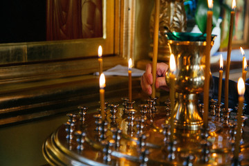 candles and icon in russian church