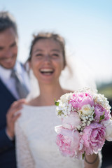 portrait beautiful smiling newlywed with a bouquet