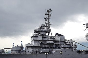 Part of the deck of a warship. communication devices and deck guns.