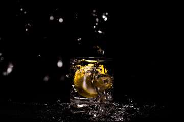 Lemon water splash in glass