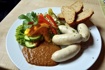 Sausages with bread and salad.