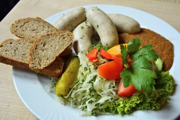 Sausages with bread and salad.