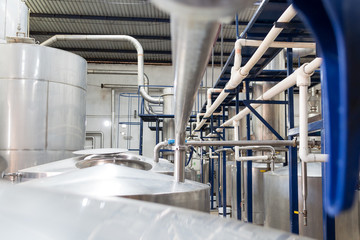 Horizontal photo in color of pipelines in a distillery in a alcoholic beverage factory