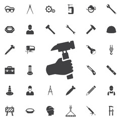 Hand holding hammer. Construction icons universal set for web and mobile