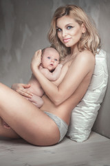 Young mother with little baby.